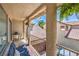 Covered outdoor balcony with comfortable seating and a view of the neighborhood at 7352 Rietz Canyon St, Las Vegas, NV 89131