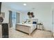 Cozy bedroom featuring a full sized bed, neutral color pallete, and a window at 7360 N Decatur Blvd # 1, Las Vegas, NV 89131