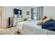 Comfortable bedroom with a soft color scheme, featuring dresser and window at 7360 N Decatur Blvd # 1, Las Vegas, NV 89131