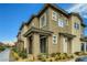 Townhome exterior showing unit number, architecture and landscaping at 7360 N Decatur Blvd # 1, Las Vegas, NV 89131
