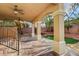Covered patio area with sturdy pillars, with stairs leading down to a grass yard at 7619 Belgian Lion St, Las Vegas, NV 89139