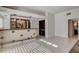 Stylish bar area with under counter refrigerator and tile flooring at 7619 Belgian Lion St, Las Vegas, NV 89139