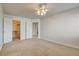 Cozy bedroom features neutral carpet, a ceiling fan, and a closet at 7619 Belgian Lion St, Las Vegas, NV 89139