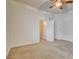Spacious bedroom with neutral carpet, ceiling fan, and walk-in closet at 7619 Belgian Lion St, Las Vegas, NV 89139