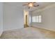 Large bedroom featuring neutral carpet and bright windows at 7619 Belgian Lion St, Las Vegas, NV 89139
