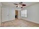 Bedroom featuring neutral walls, ceiling fan, tiled floor and shuttered window at 7619 Belgian Lion St, Las Vegas, NV 89139