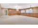 Spacious bonus room features a built-in wall of cabinets and drawers with natural light and neutral tones at 7619 Belgian Lion St, Las Vegas, NV 89139