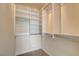 Walk-in closet with neutral carpet and built-in shelves at 7619 Belgian Lion St, Las Vegas, NV 89139
