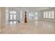 Bright entryway showcasing tiled flooring, high ceilings, and custom lighting at 7619 Belgian Lion St, Las Vegas, NV 89139