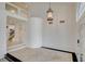 Welcoming entryway with tiled floors, custom lighting, and an open layout at 7619 Belgian Lion St, Las Vegas, NV 89139