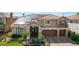 Charming two-story home with solar panels, a three-car garage, and lush landscaping at 7619 Belgian Lion St, Las Vegas, NV 89139