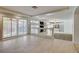 An open concept living room area leads to a fireplace and bar area with tile floors throughout at 7619 Belgian Lion St, Las Vegas, NV 89139
