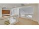 Open loft area with built-in cabinetry, stairs, and a view of a vaulted ceiling at 7619 Belgian Lion St, Las Vegas, NV 89139