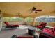 Covered patio with ceiling fans and comfortable outdoor seating area at 7619 Belgian Lion St, Las Vegas, NV 89139