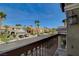From the balcony, a view of a quiet residential street lined with palm trees and well-kept homes at 7619 Belgian Lion St, Las Vegas, NV 89139
