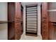 Spacious walk-in closet with custom shelving and storage drawers for organization at 7619 Belgian Lion St, Las Vegas, NV 89139