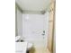 Clean bathroom featuring a shower-tub combo, wood-look vanity, and a tall storage cabinet at 8101 W Flamingo Rd # 1088, Las Vegas, NV 89147