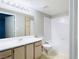 Bright bathroom features an extended vanity and shower-tub combo with white tile surround at 8101 W Flamingo Rd # 1088, Las Vegas, NV 89147