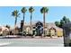 A welcoming clubhouse with a manicured landscape with palm trees, perfect for community gatherings at 8101 W Flamingo Rd # 1088, Las Vegas, NV 89147