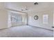 Primary bedroom with tray ceiling, bay window and neutral carpet at 8143 Retriever Ave, Las Vegas, NV 89147