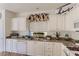 Kitchen area featuring granite countertops, white cabinets, and modern appliances at 8143 Retriever Ave, Las Vegas, NV 89147