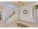 Living room area featuring tiled floors, white trim, a rug, and neutral walls at 8143 Retriever Ave, Las Vegas, NV 89147