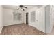 Bright bedroom featuring wood-look floors, a ceiling fan, and a closet with shelving at 9048 Faversham Ct, Las Vegas, NV 89123