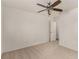 Bedroom featuring a ceiling fan, neutral carpet, and doorway to the rest of the house at 9048 Faversham Ct, Las Vegas, NV 89123