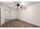 This bedroom features wood-look flooring, a ceiling fan, and white walls at 9048 Faversham Ct, Las Vegas, NV 89123
