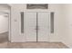 Interior foyer featuring double doors and tile flooring at 9048 Faversham Ct, Las Vegas, NV 89123