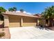 Single-story home showing a three-car garage, desert landscaping, and a concrete driveway at 9048 Faversham Ct, Las Vegas, NV 89123