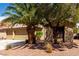 Single-story home featuring a three-car garage and desert landscaping at 9048 Faversham Ct, Las Vegas, NV 89123