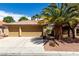 Charming single-story home with a three-car garage, beautiful desert landscaping, and a tiled roof at 9048 Faversham Ct, Las Vegas, NV 89123