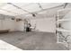 Spacious two-car garage with ample storage shelving and functional utility sink at 9048 Faversham Ct, Las Vegas, NV 89123
