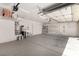 Spacious two-car garage featuring shelving and utility sink at 9048 Faversham Ct, Las Vegas, NV 89123