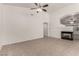 Spacious living room with tile flooring, an electric fireplace, and neutral paint colors at 9048 Faversham Ct, Las Vegas, NV 89123