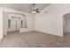 Open-concept living room with tile flooring, high ceilings, and a ceiling fan at 9048 Faversham Ct, Las Vegas, NV 89123