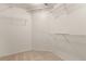 Walk-in closet with neutral carpet and multiple shelves for optimal storage at 9048 Faversham Ct, Las Vegas, NV 89123