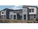 Modern townhome exterior featuring desert landscaping, unique architecture, and private entrances at 9326 Soothing Sea St # Lot 93, Las Vegas, NV 89178