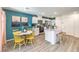 Bright eat-in kitchen featuring stainless appliances, a center island with bar seating, and stylish decor at 9326 Soothing Sea St # Lot 93, Las Vegas, NV 89178