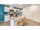 Bright kitchen featuring stainless appliances, a center island with bar seating, and white cabinetry at 9326 Soothing Sea St # Lot 93, Las Vegas, NV 89178