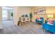 Cozy sitting room featuring stylish decor, neutral carpet, and bright furniture and art at 9326 Soothing Sea St # Lot 93, Las Vegas, NV 89178