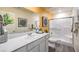 Bright bathroom featuring a spacious vanity, modern fixtures, and a glass-enclosed shower at 9330 Soothing Sea St # Lot 92, Las Vegas, NV 89178