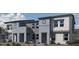 Contemporary townhome showcasing a modern facade, landscaped front yard, and private entrances at 9330 Soothing Sea St # Lot 92, Las Vegas, NV 89178