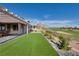 Lush artificial turf, scenic golf course views, and manicured landscaping create a serene backyard retreat at , Las Vegas, NV 89134