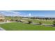 Expansive backyard featuring artificial turf and views of the verdant golf course and majestic mountain range at , Las Vegas, NV 89134