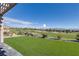 Beautiful backyard featuring lush green artificial turf and a stunning view of the golf course at , Las Vegas, NV 89134