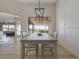 Bright dining room features a modern chandelier, views, and an open floor plan at , Las Vegas, NV 89134
