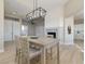 Dining room with wood floors, modern chandelier, and access to kitchen and living areas at , Las Vegas, NV 89134