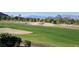 Expansive view of a lush golf course with rolling hills and mature trees at , Las Vegas, NV 89134